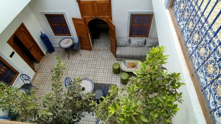 Riad Bab Lakhmiss courtyard pool and palm terrace in Marrakech medina