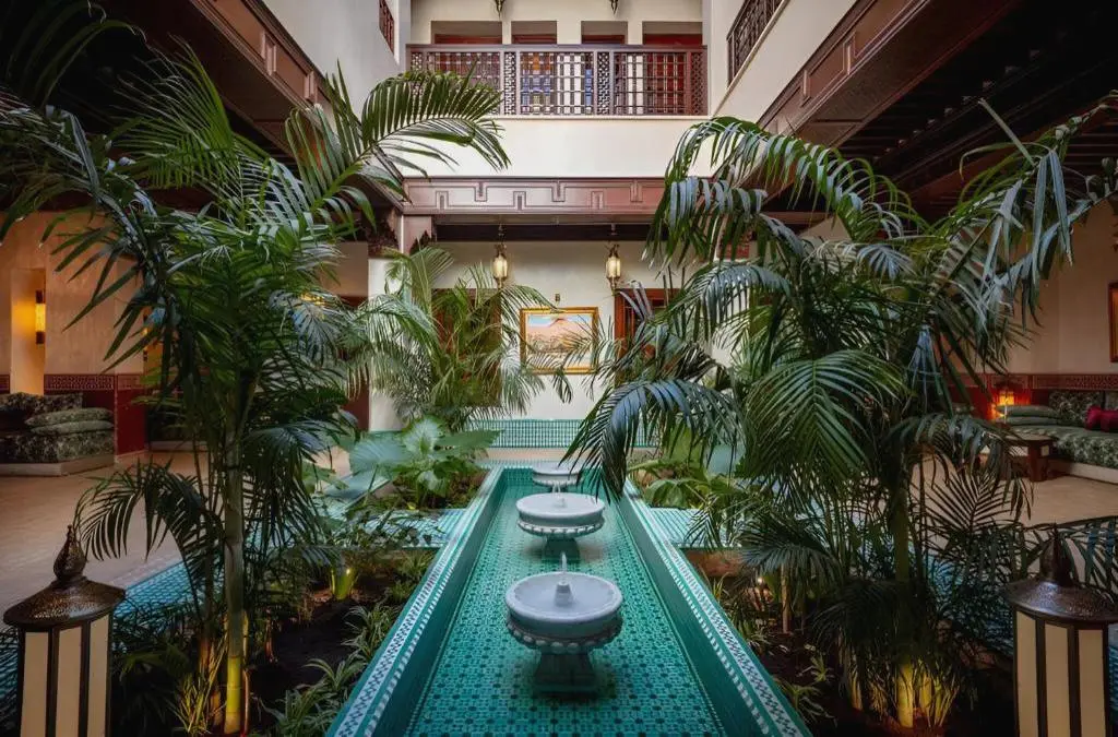 Traditional Moroccan suite and handcrafted decor at Riad Kniza Marrakech