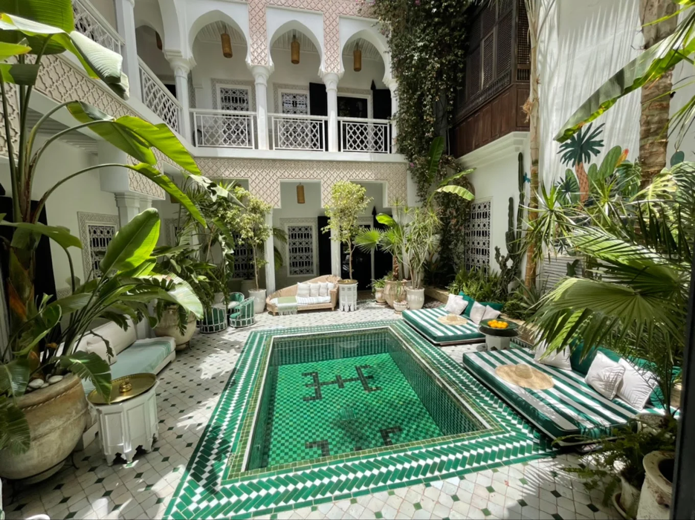 Riad Yasmine courtyard pool with green tiles in Marrakech medina